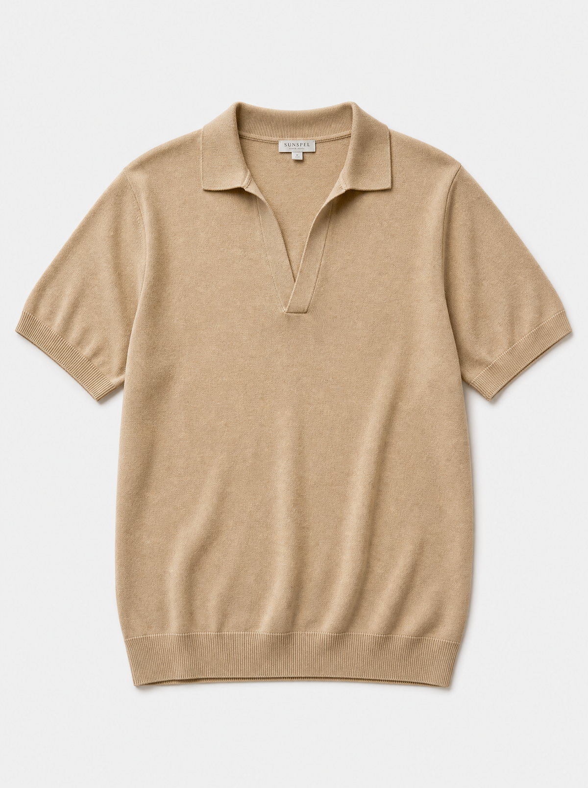 The Portofino Polo — sand fine-gauge knit cotton short-sleeve henley polo, front view