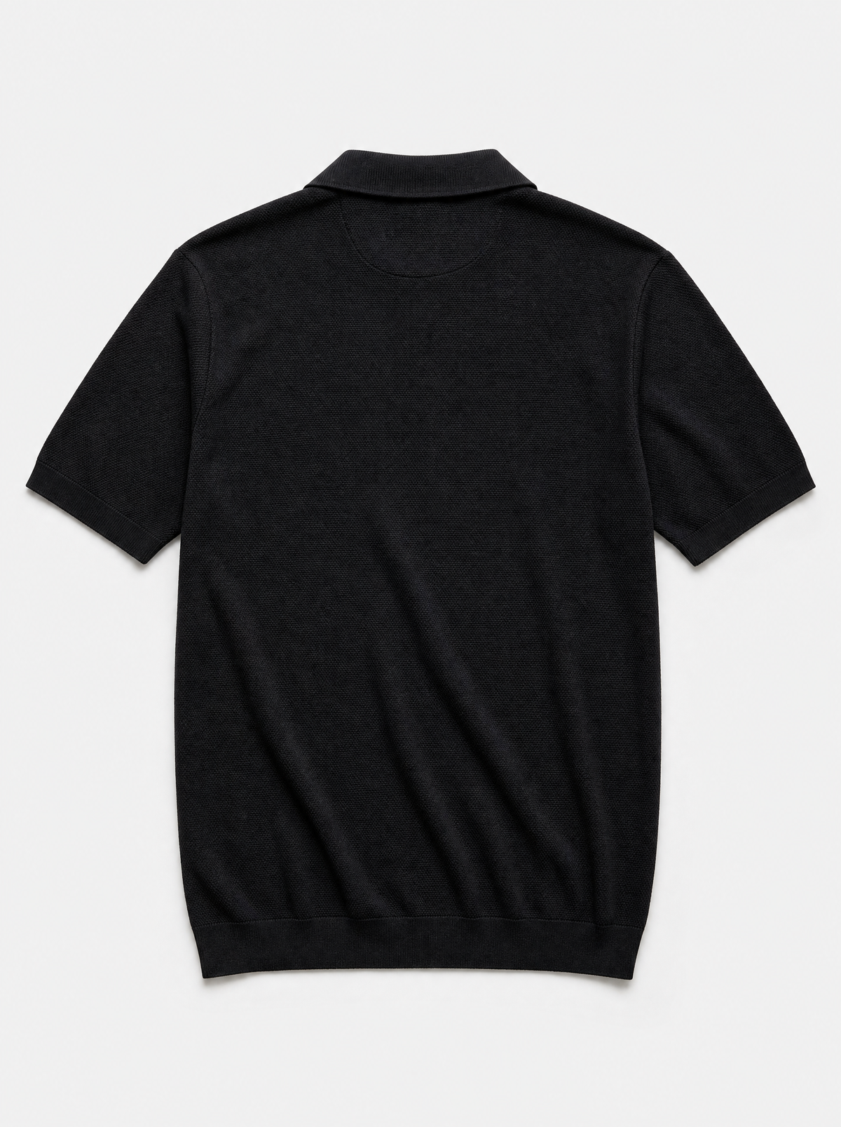 The Portofino Polo — black fine-gauge knit cotton short-sleeve henley polo, back view