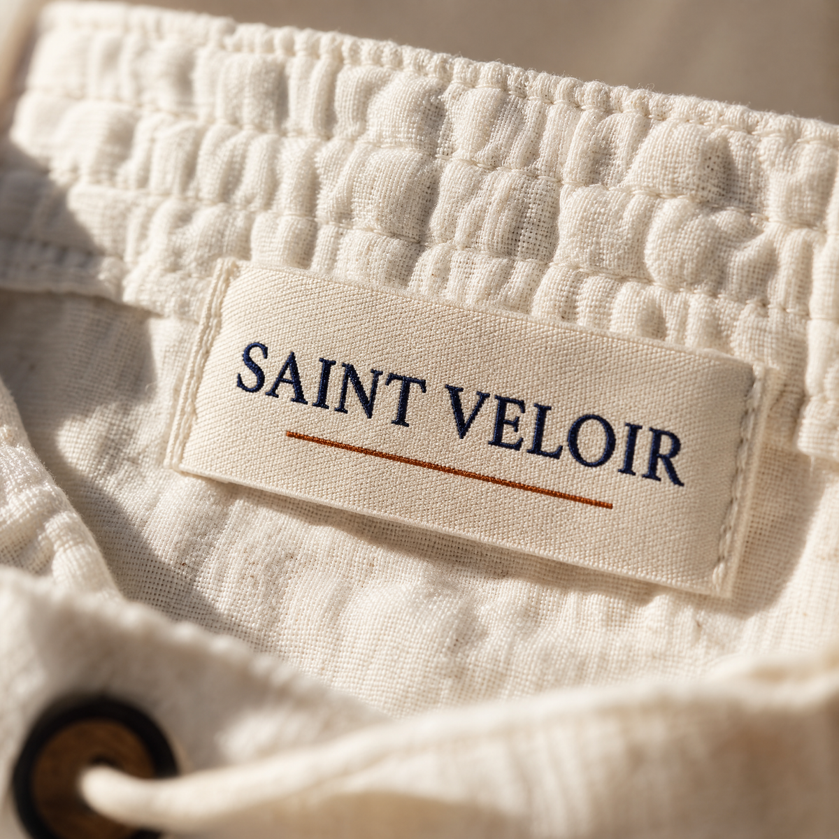 Saint Veloir woven label inside the waistband of The Procida Pant