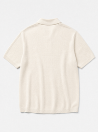 The Portofino Polo — ivory fine-gauge knit cotton short-sleeve henley polo, back view