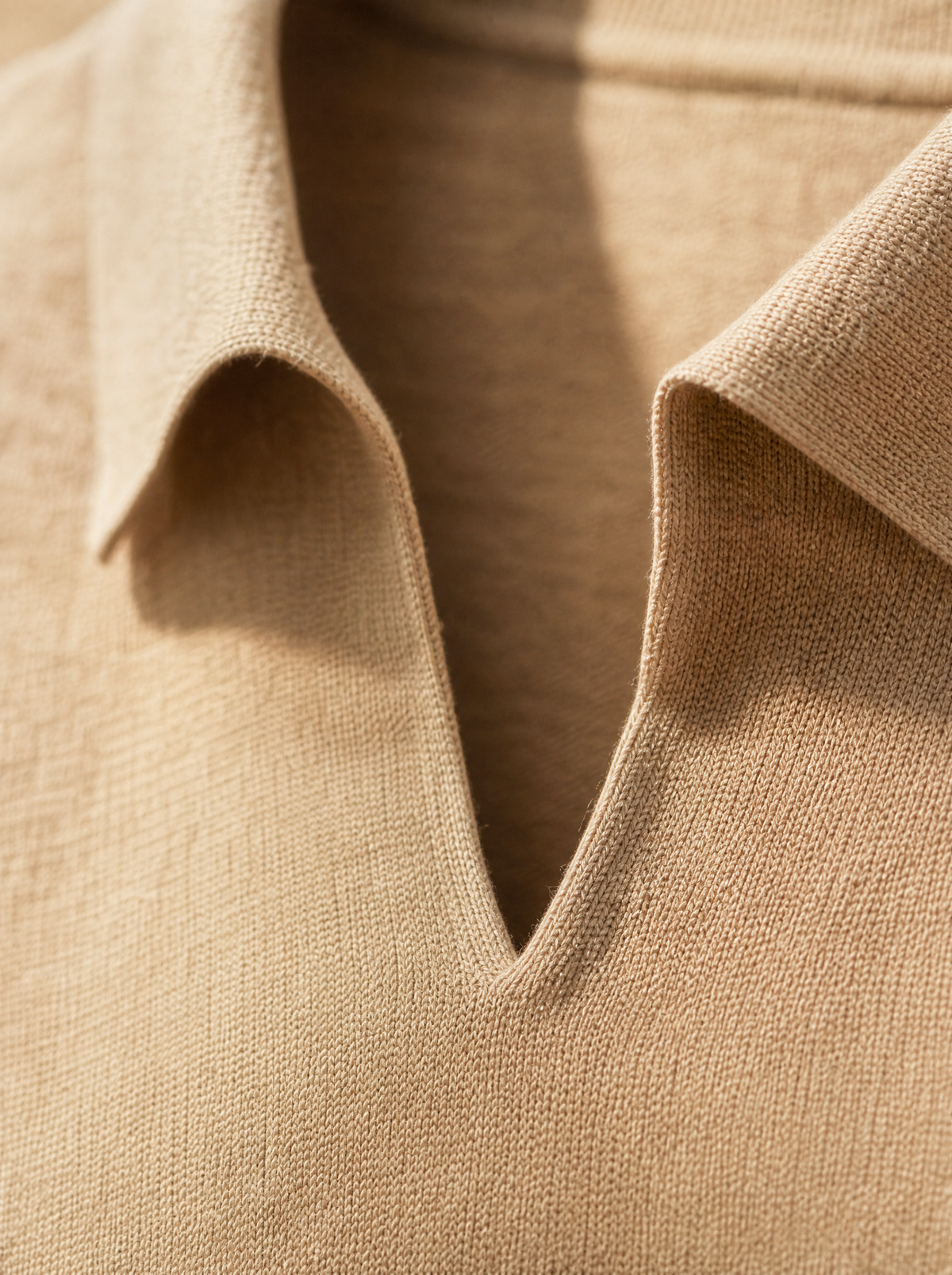 Open V-neck and knitted collar detail — The Portofino Polo