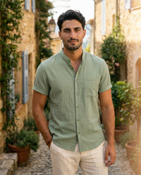 The Antibes Shirt - Sage on model, standing in Provencal alley